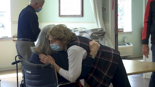 Residents hugging at Harrison House, Georgetown