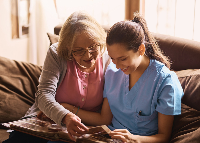 Nurse and resident at a memory care facility.